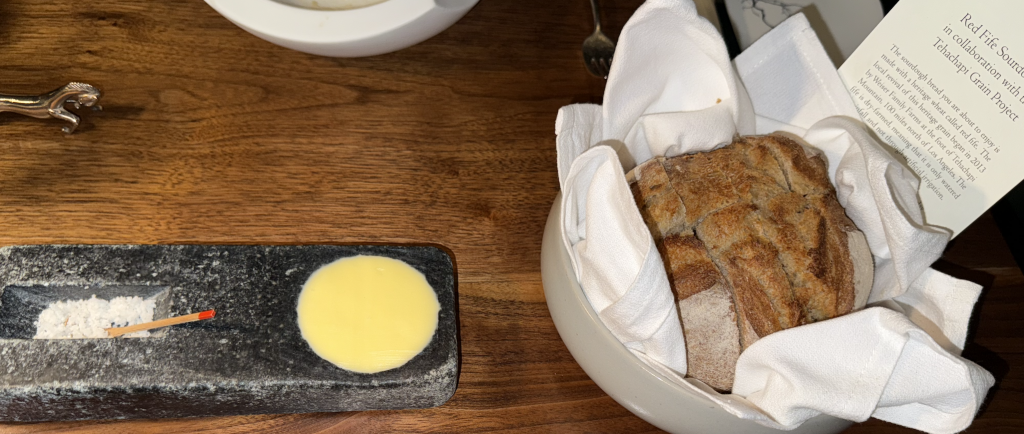 The bread course, complete with an info card and...that adorbs little salt "shovel!" Photo by Karen Salkin.
